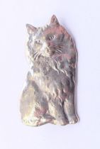 A silver brooch in the form of a cat. 3 cm high.