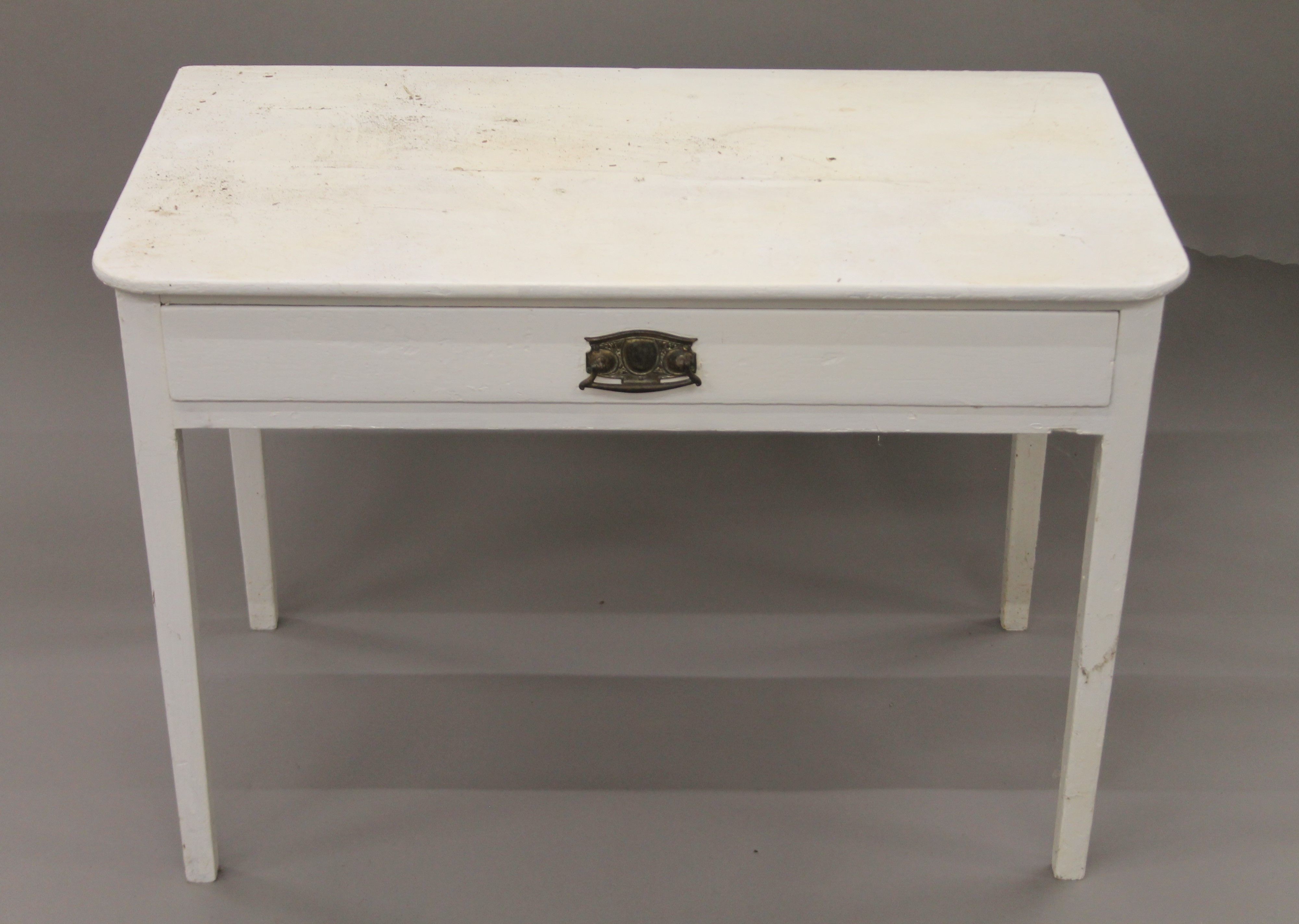 A Victorian white painted side table. 91 cm wide.