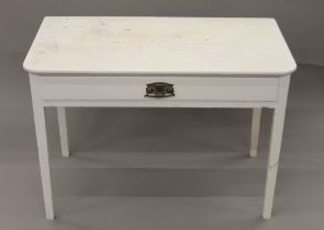 A Victorian white painted side table. 91 cm wide.