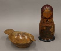 An early 20th century Russian wooden doll of typical form and a Scandinavian chip carved wood bowl