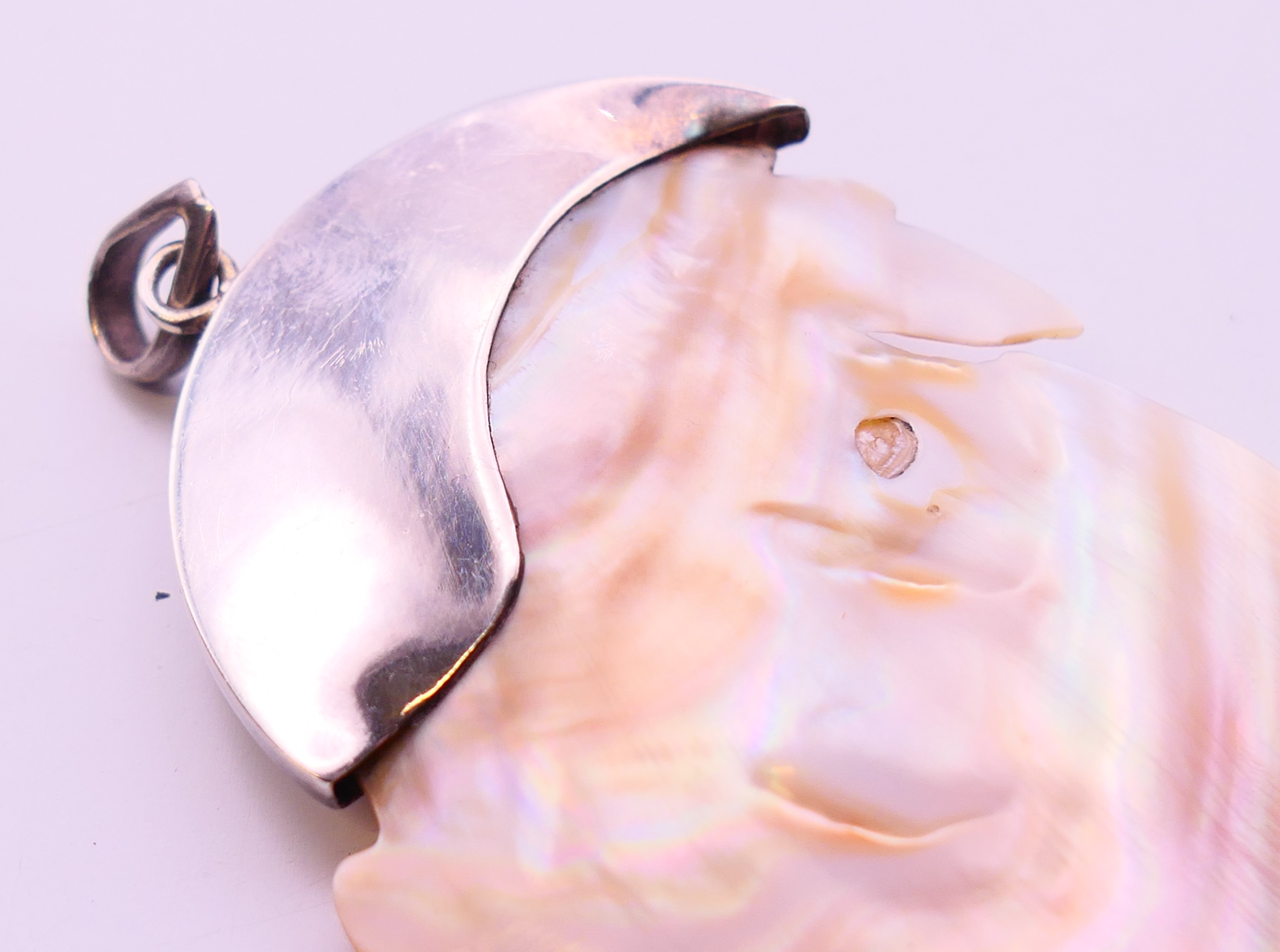 A silver mounted mother-of-pearl pendant. 7 cm high. - Image 4 of 5