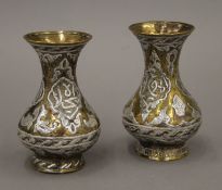 A pair of Cairo ware vases. 10 cm high.