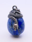 A silver and lapiz egg and snake pendant. 2.5 cm high.