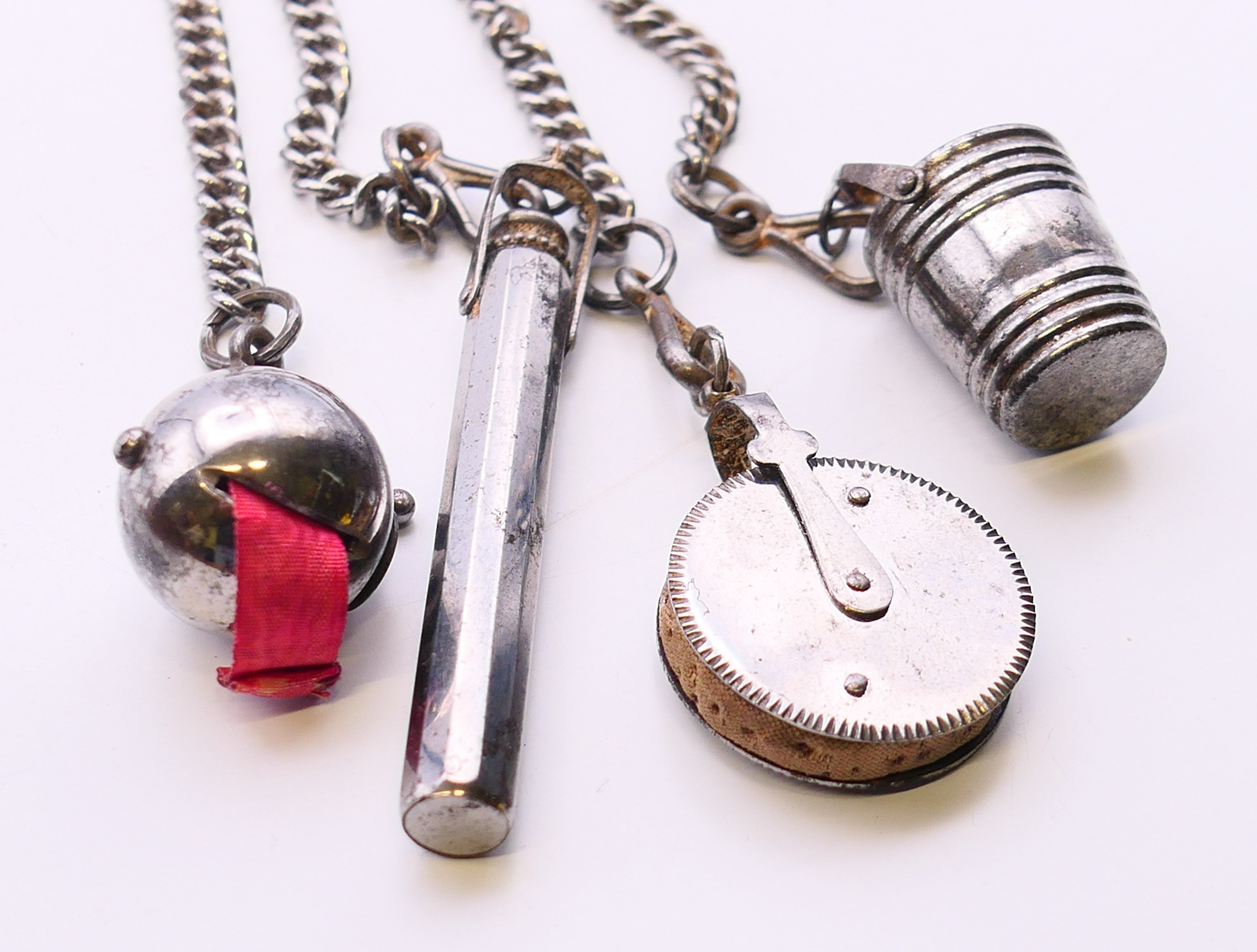 A 19th century steel chatelaine consisting of four implements on chains leading to a horseshoe - Image 4 of 4