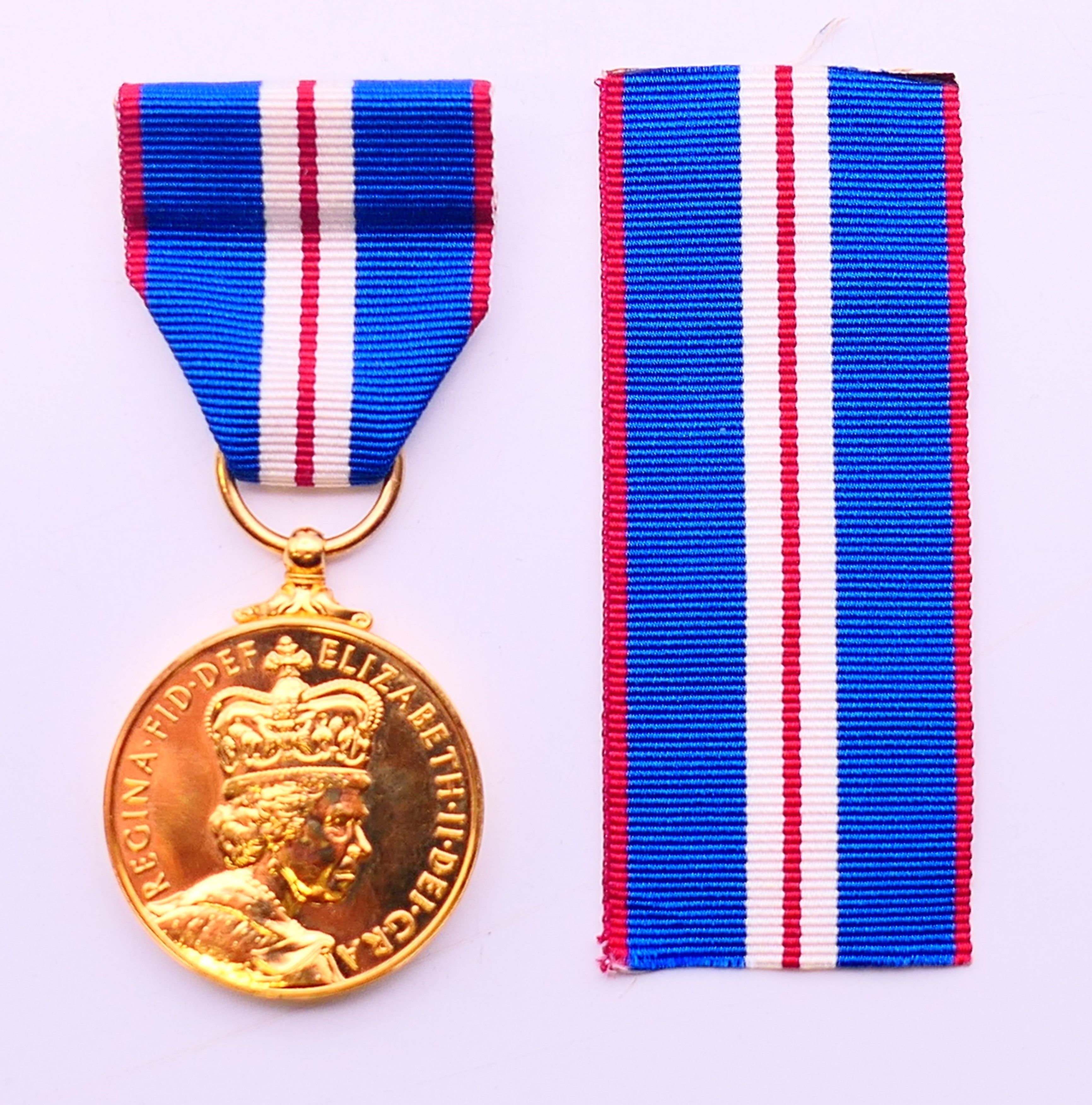 The Queen Jubilee Medal (1952-2002), boxed, with spare ribbon.