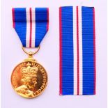 The Queen Jubilee Medal (1952-2002), boxed, with spare ribbon.
