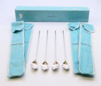 Four boxed Tiffany and Co silver cocoa spoons. 21.5 cm high.