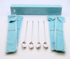 Four boxed Tiffany and Co silver cocoa spoons. 21.5 cm high.