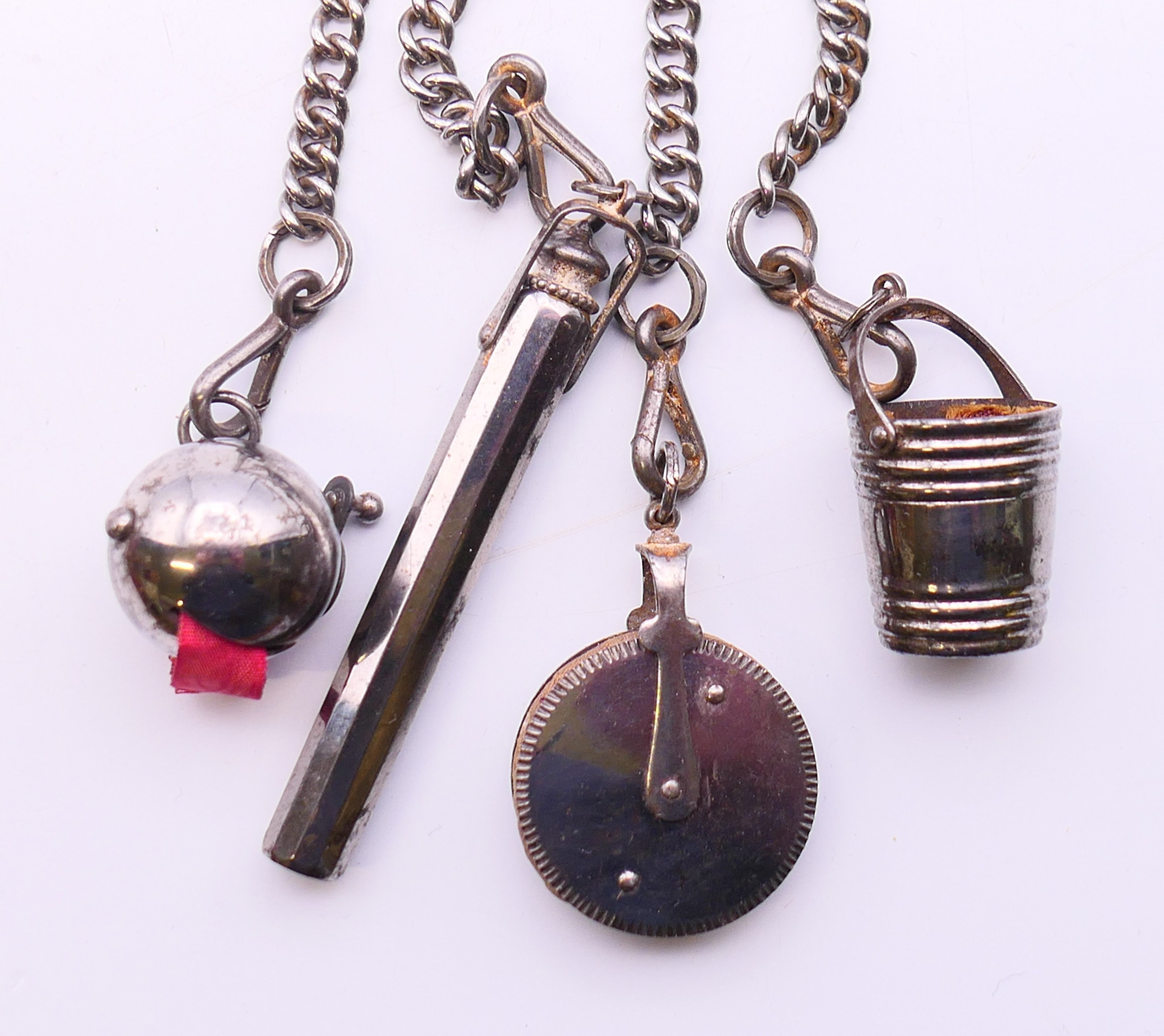 A 19th century steel chatelaine consisting of four implements on chains leading to a horseshoe - Image 3 of 4