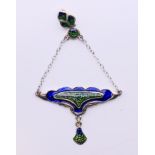 A silver Art Nouveau-style pendant. 7 cm high.