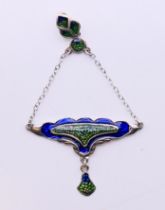 A silver Art Nouveau-style pendant. 7 cm high.