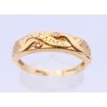 A 9 ct gold and diamond ring with two doves and marked Je T'aime. Ring size Q/R.