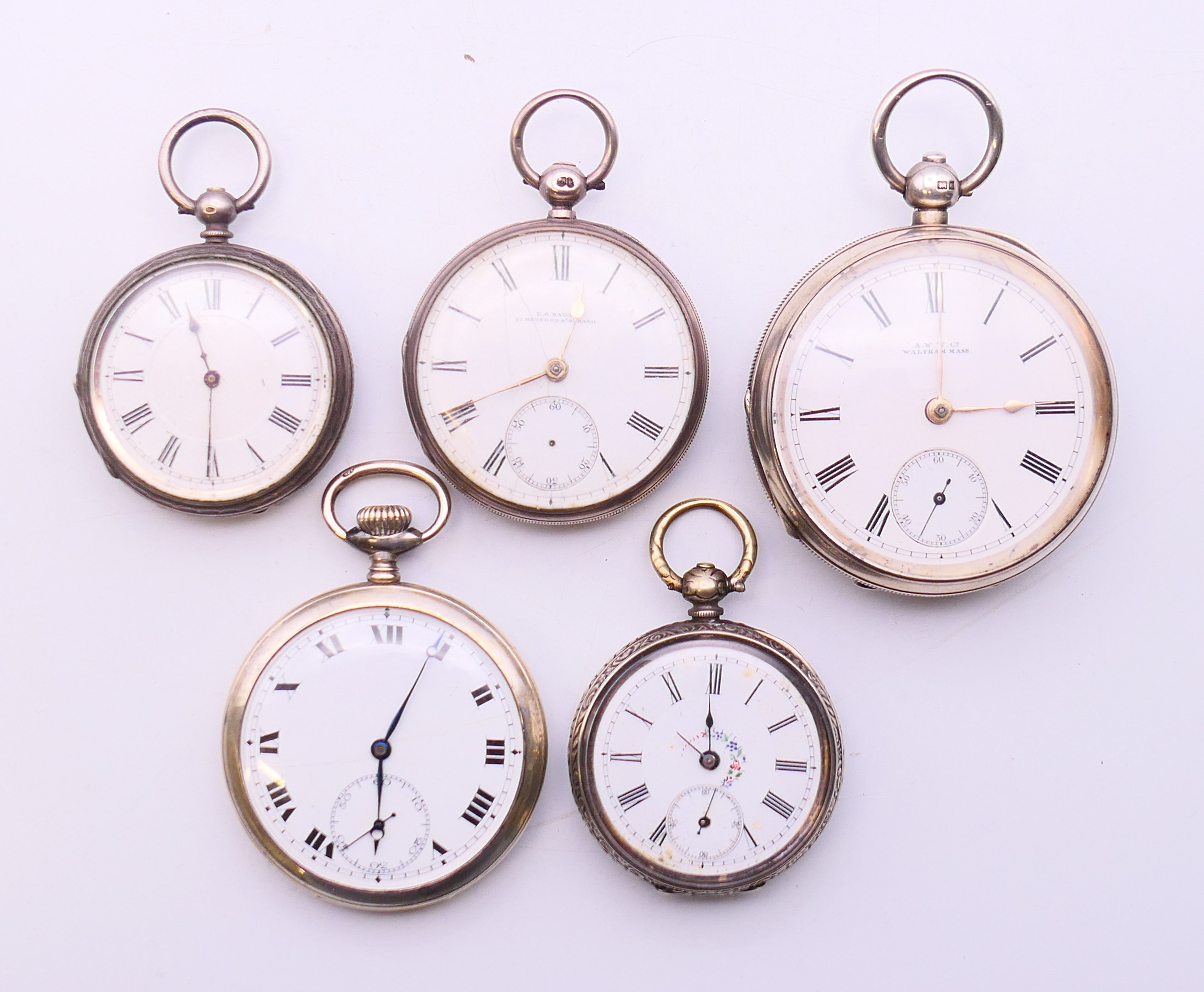 Five silver pocket watches. Largest 5 cm diameter.