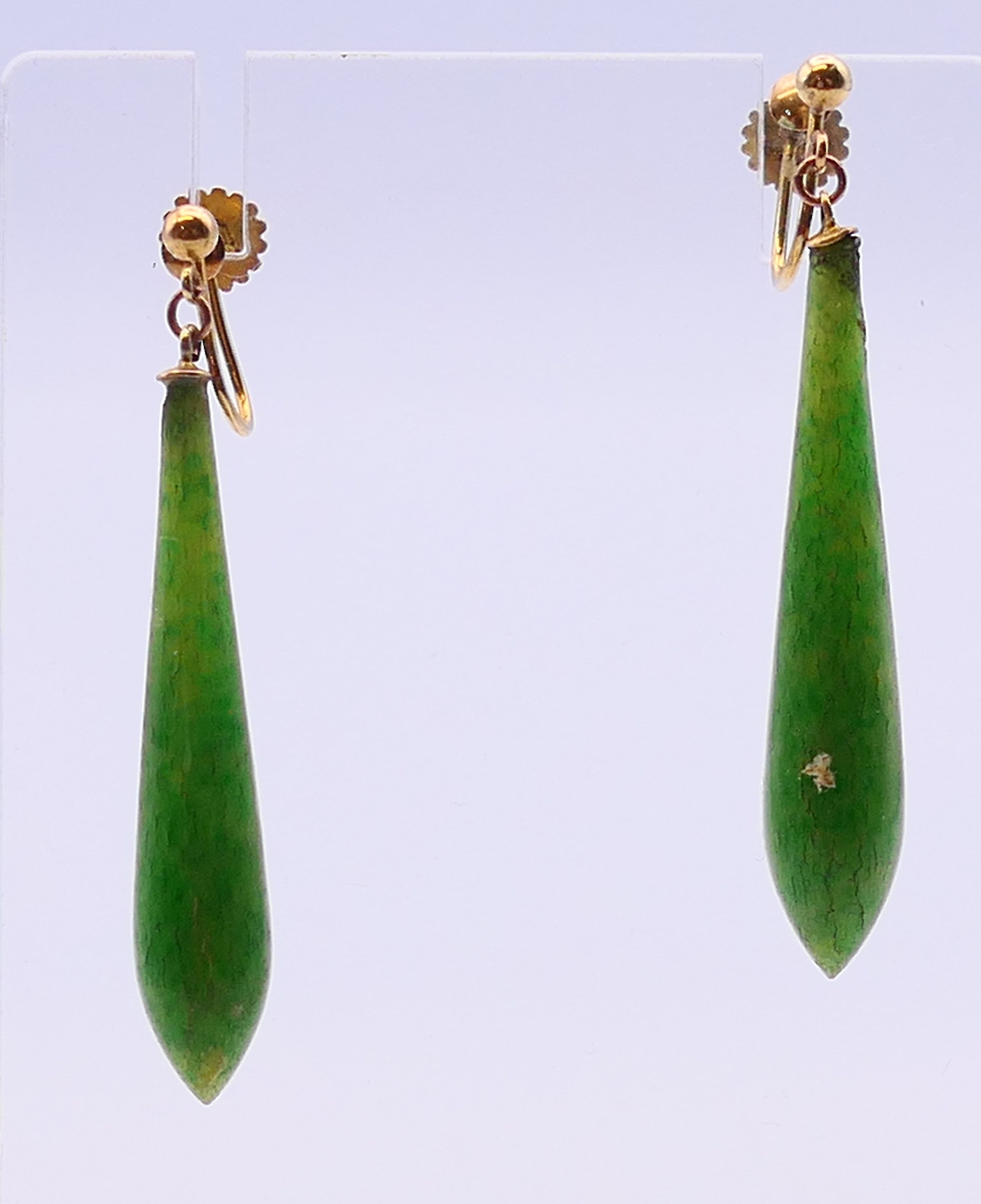 A pair of 9 ct gold and jade earrings. 4 cm high.