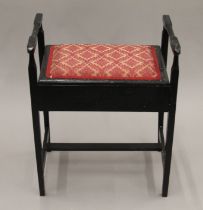 An Edwardian ebonised piano stool. 50 cm wide.