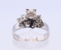 An 18 k white gold and diamond ring. Ring size NO/P.