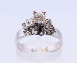 An 18 k white gold and diamond ring. Ring size NO/P.