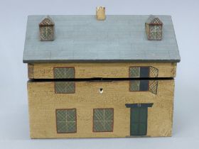 A tea caddy in the form of a house. 26 cm wide.
