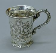 A Victorian embossed silver christening mug. 8.5 cm high. 118.3 grammes.