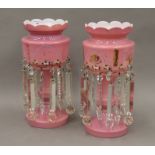 A pair of Victorian pink ground glass lustres. 38 cm high.