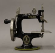 An antique Singer miniature (child's) sewing machine "A Singer for the Girls" circa 1910,