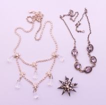 A small quantity of costume jewellery to include two necklaces and a star form brooch. Brooch 3.