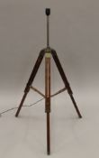 A tripod form lamp. 130 cm high.