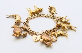 A 9 ct gold curb link bracelet with eight animal charms. 18 cm long. 60.