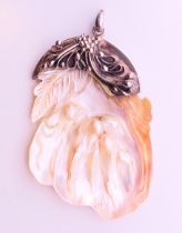 A silver mounted mother-of-pearl pendant. 7 cm high.