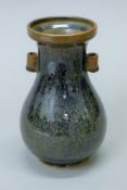 A Chinese brown pottery vase. 20 cm high.