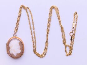 A cameo locket with modern 9 ct gold chain. Locket 2.5 cm high, chain 51 cm long.
