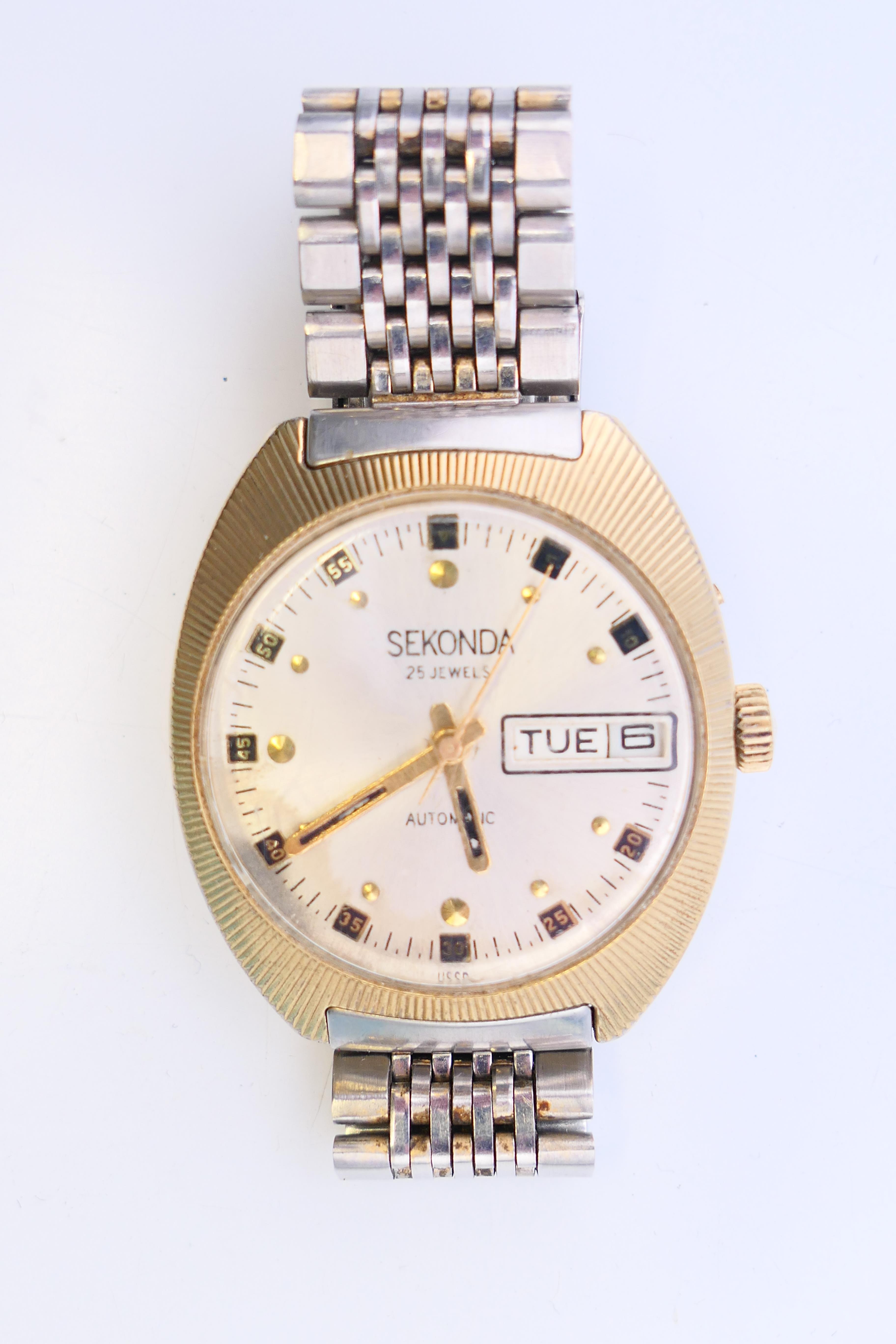 A Sekonda gentleman's wristwatch with day/date aperture. 4 cm diameter. - Bild 4 aus 6