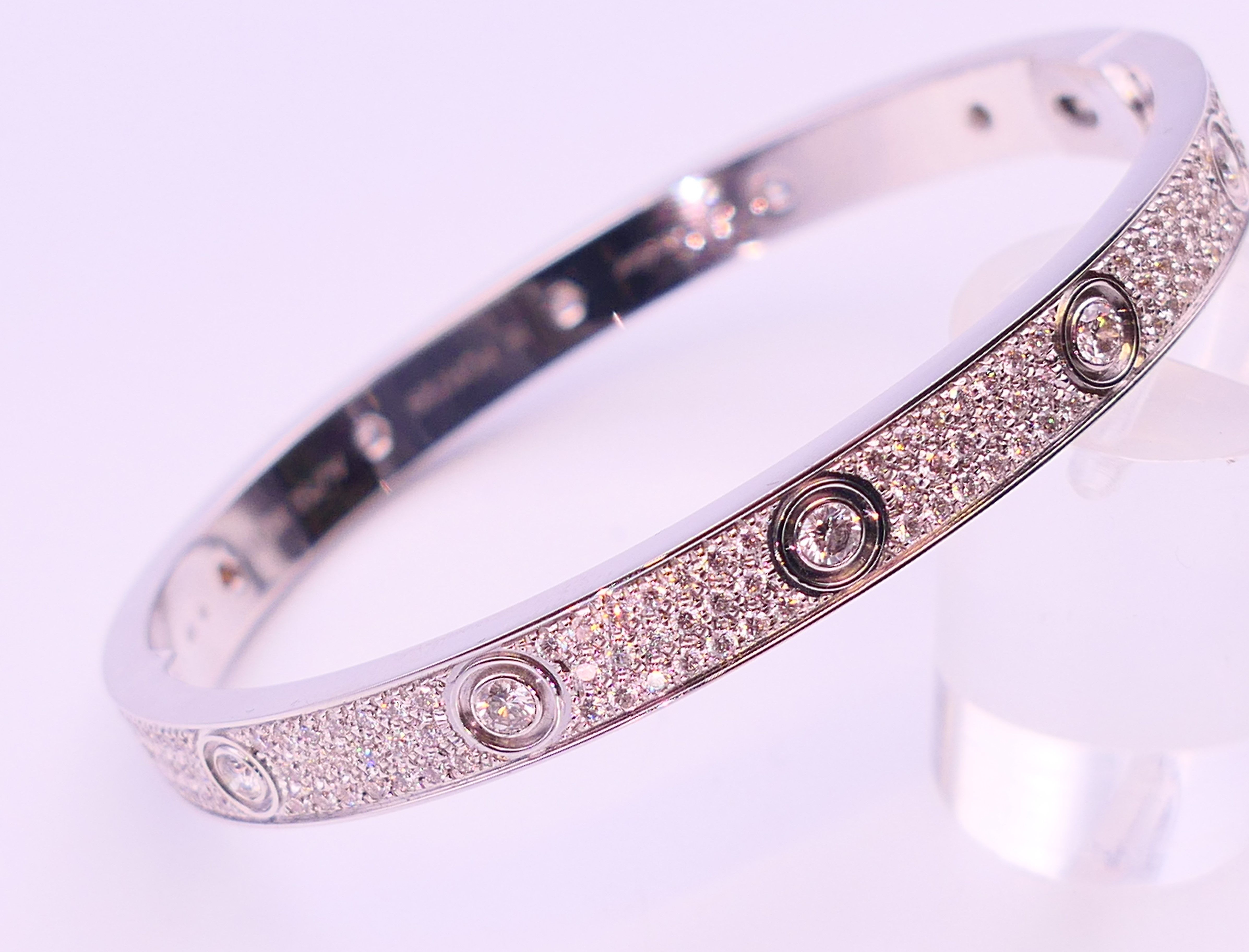 A Cartier 18 K white gold and diamond encrusted love bangle numbered 19 PDR729. 6. - Image 12 of 13