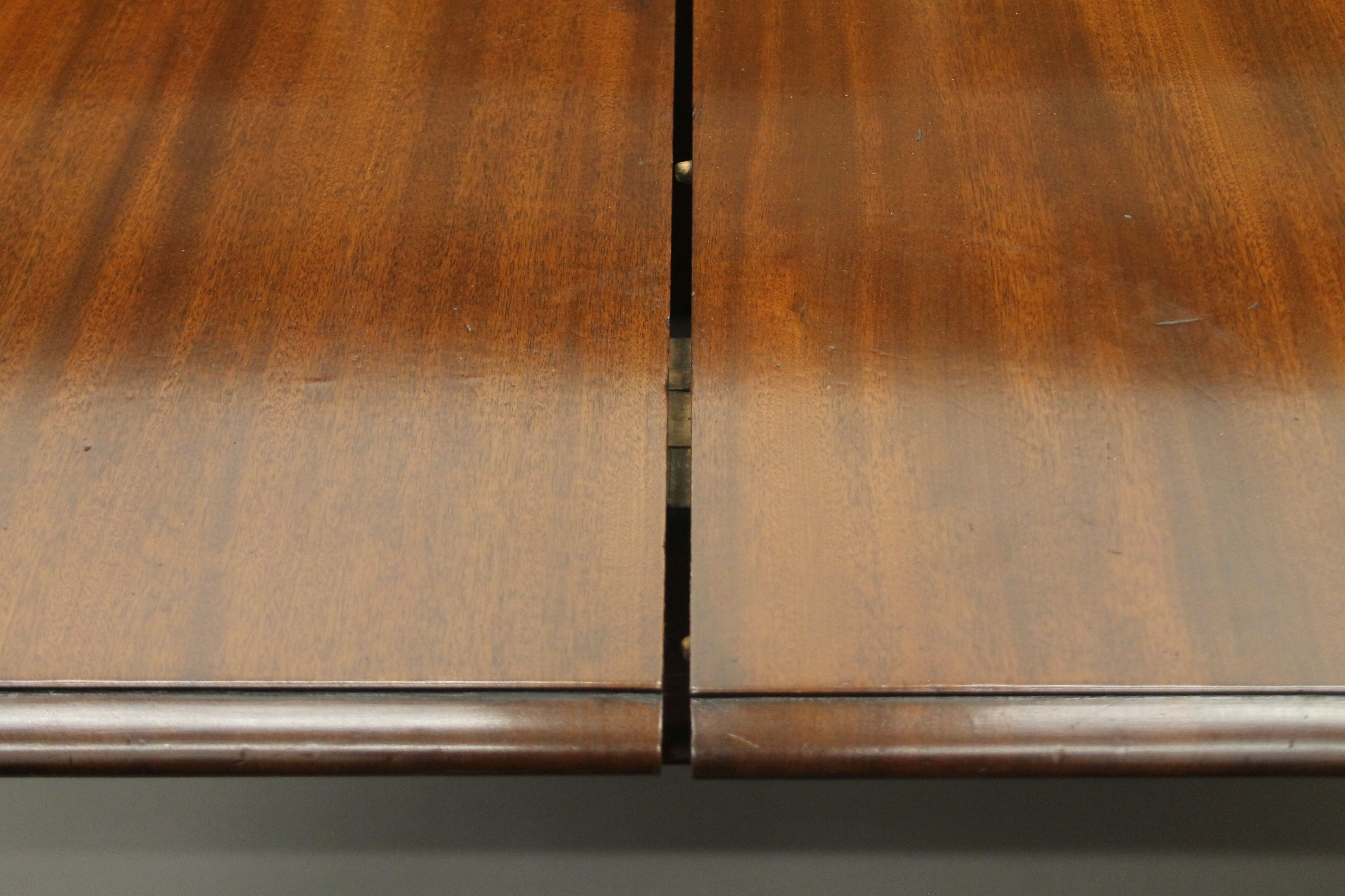 A 19th century mahogany three-leaf extending dining table. - Image 3 of 5