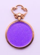 A 9 ct gold double photo locket pendant. 3.5 cm high including suspension loop.