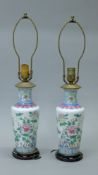 A pair of Chinese porcelain lamps. 59 cm high overall.