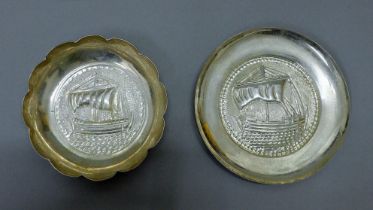 Two 800 silver dishes, each embossed with a boat. The largest 11.5 cm. 83.6 grammes.