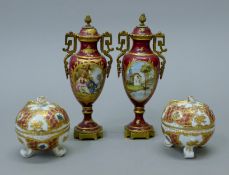A pair of Continental porcelain lidded vases with gilt metal mounts and a pair of Continental