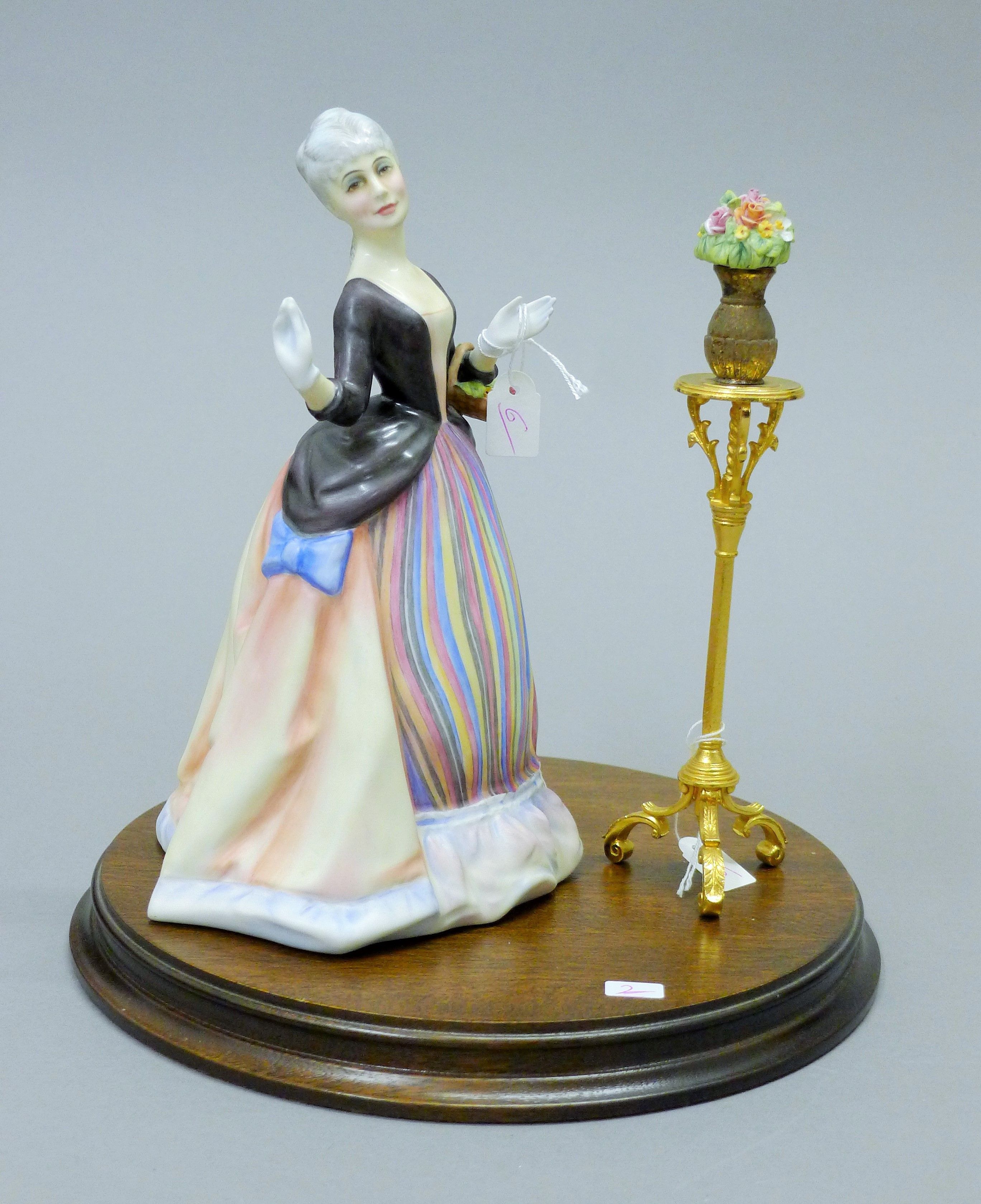 A Royal Doulton figurine, Flower Arranging, HN3040. 22 cm high.