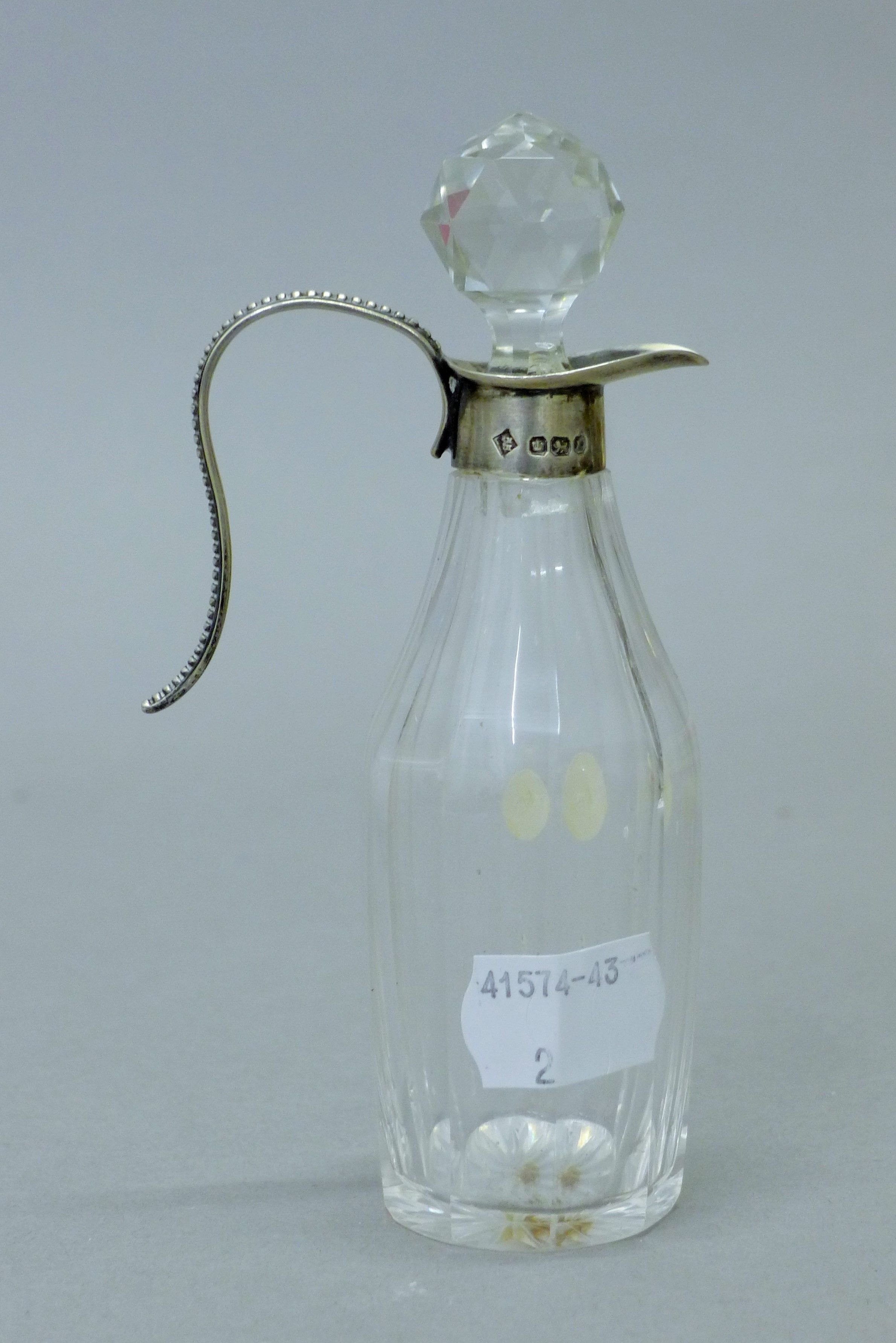 Two silver top cut glass oil and vinegar bottles, both with English silver marks. The tallest 14. - Image 5 of 7