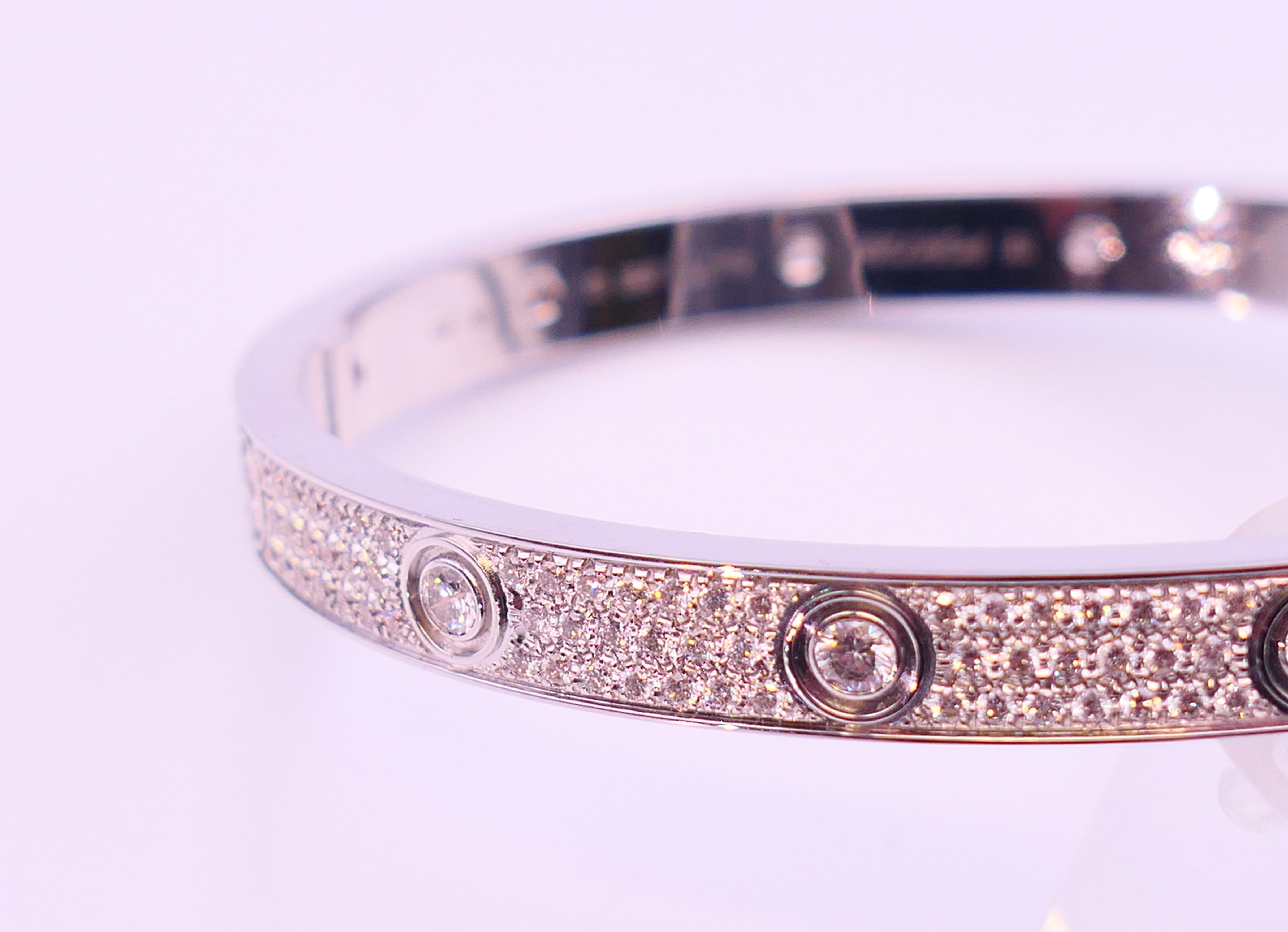 A Cartier 18 K white gold and diamond encrusted love bangle numbered 19 PDR729. 6. - Image 10 of 13