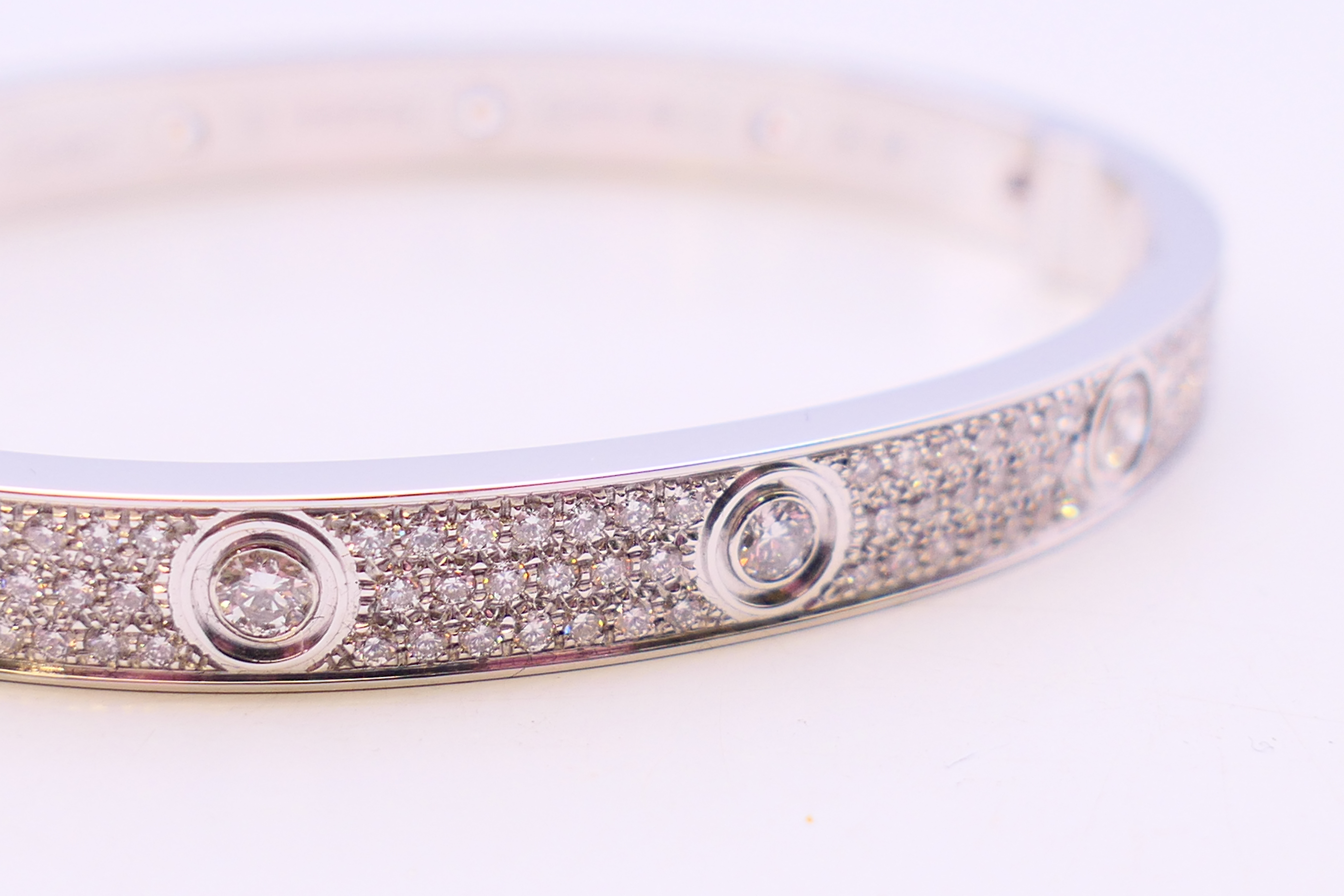 A Cartier 18 K white gold and diamond encrusted love bangle numbered 19 PDR729. 6. - Image 2 of 13