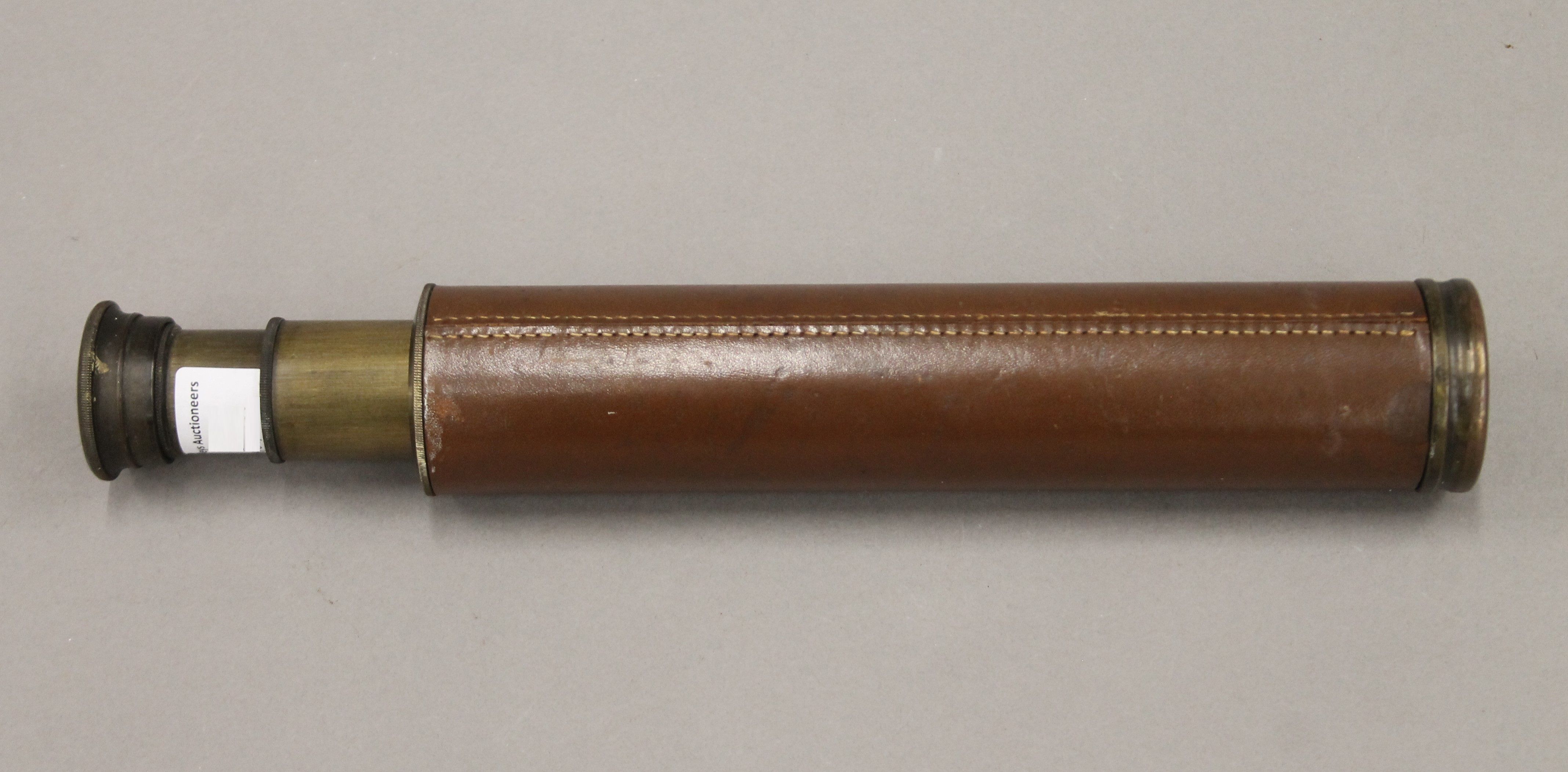 A leather-bound brass three-draw telescope, stamped Rangers Enbeeco, London. 69 cm long extended. - Image 2 of 6