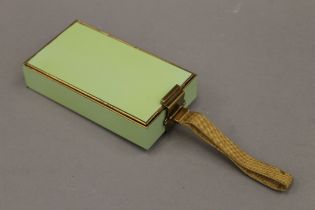 An early 20th century Art Deco ladies compact. 11.5 cm long.