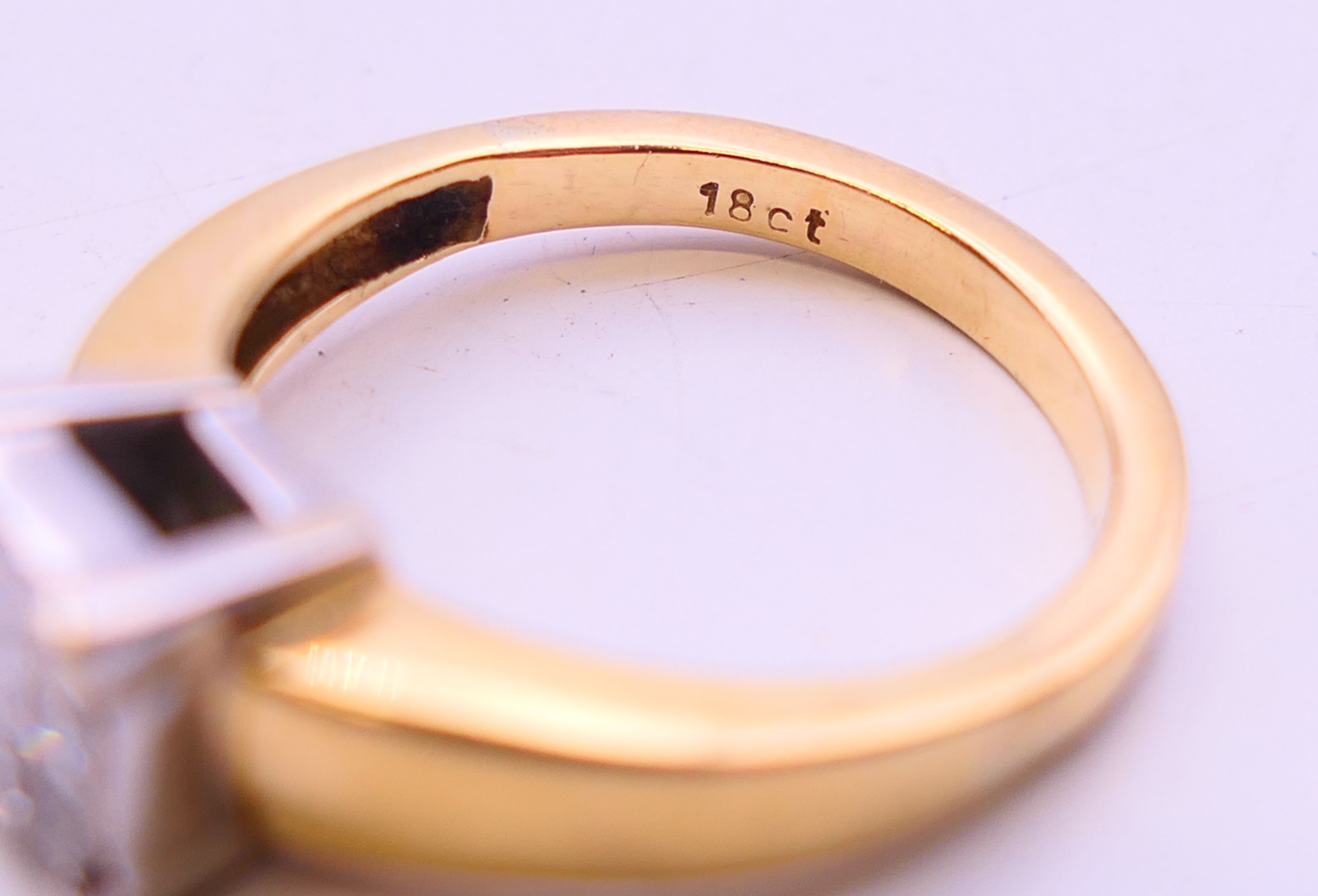 An 18 ct gold ring set with nine diamonds. together with a copy of a 2012 insurance valuation. - Image 6 of 8