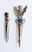 A Scottish stone set silver brooch and Scottish piper's brooch. 22.6 grammes. Largest 8.5 cm high.