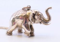 A silver hallmarked elephant pendant on a silver chain. Elephant 4 cm x 2.5 cm, chain 74 cm long.