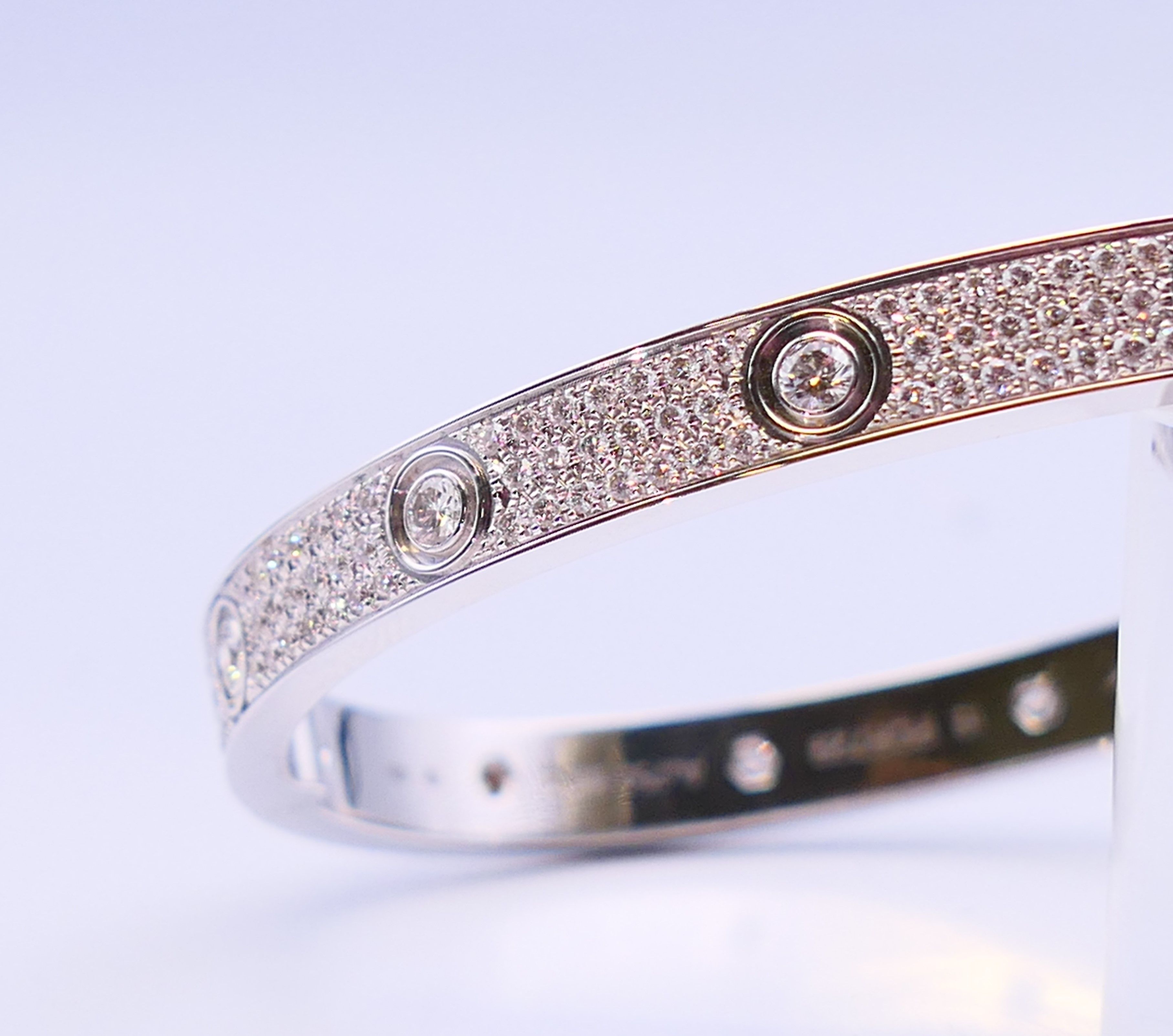 A Cartier 18 K white gold and diamond encrusted love bangle numbered 19 PDR729. 6. - Image 11 of 13
