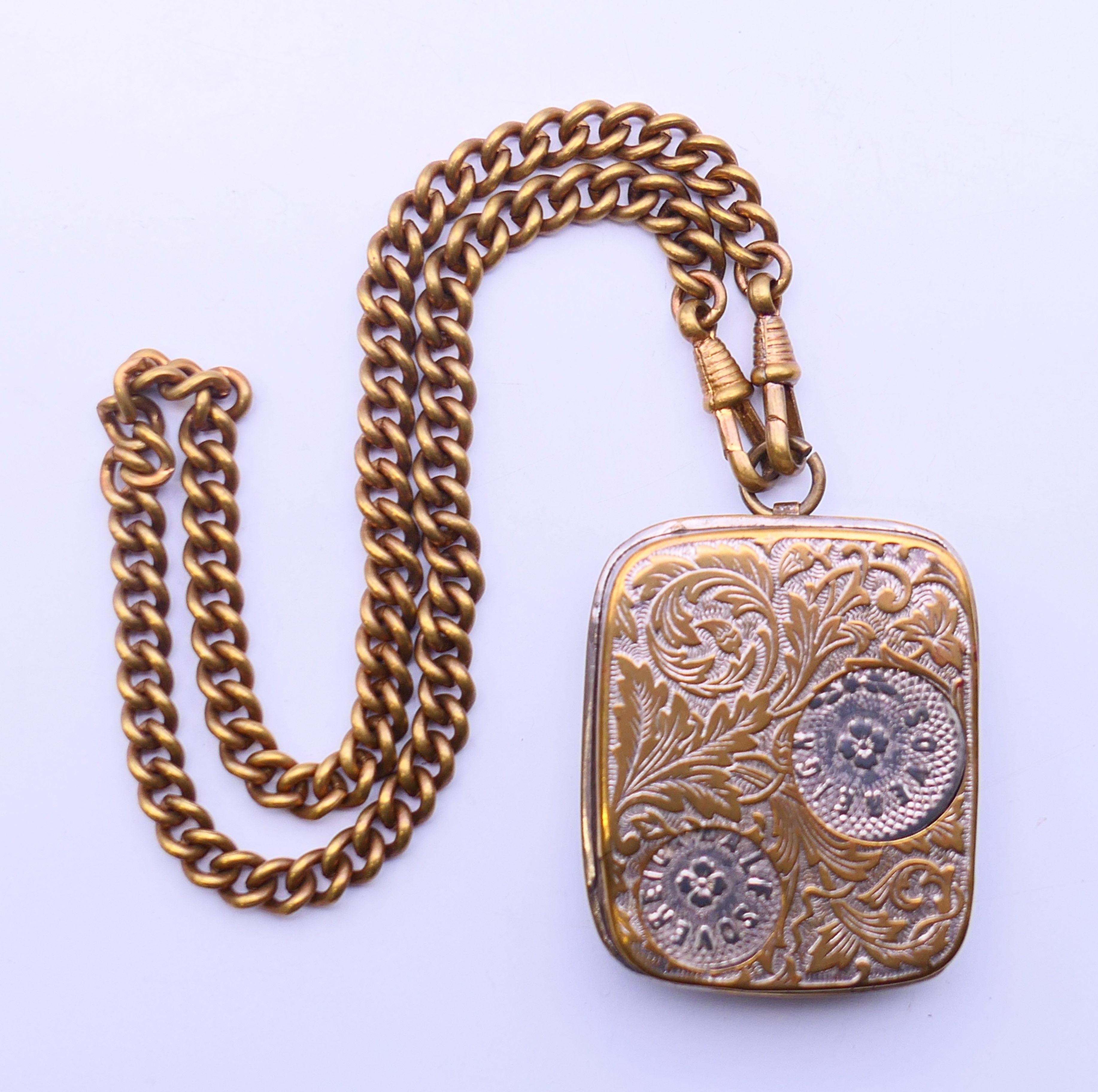 An Edwardian coin dispenser on chain. 5 cm x 4 cm.