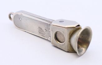 A silver cigar cutter. 7 cm high.